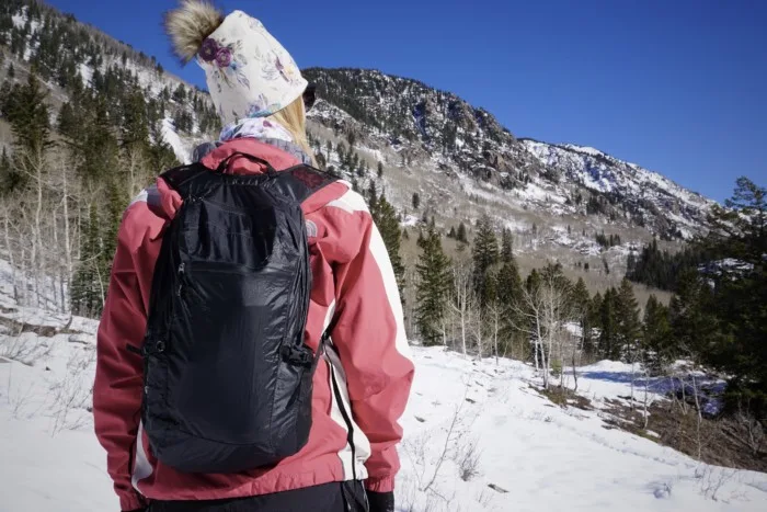Matador Freefly 16 Ultralight Daypack on a snowy mountain trail