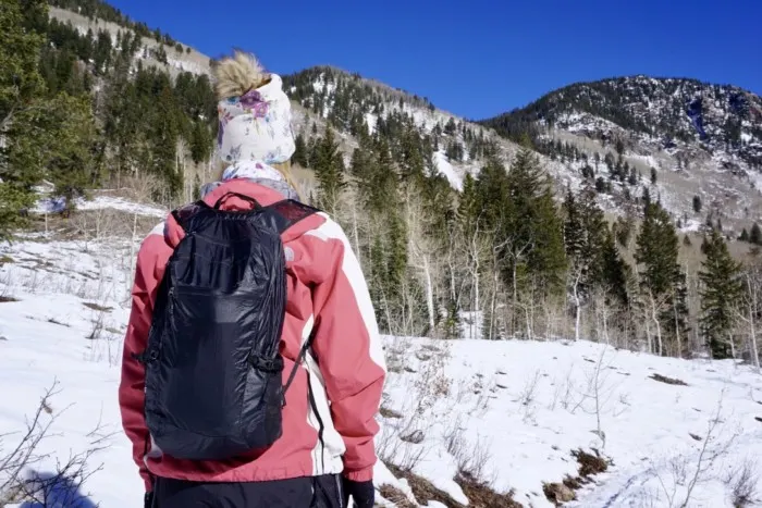 a girl wearing the Matador Freefly 16 Backpack which can be a great gift idea for hikers and backpackers