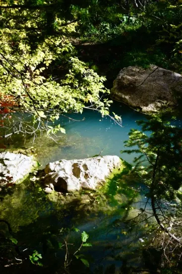 the emerald blue water in fifth water creek