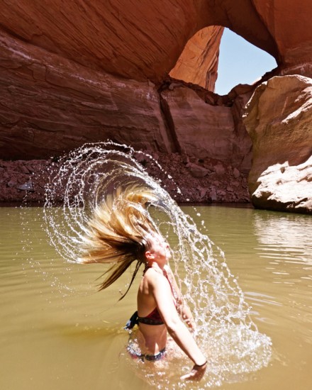 Emily washing her hair in Lake Powell with Bio-Degradable Soap which is such an easy way to shower on the road