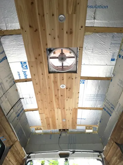 Progress being made on installing the cedar ceiling in campervan roof