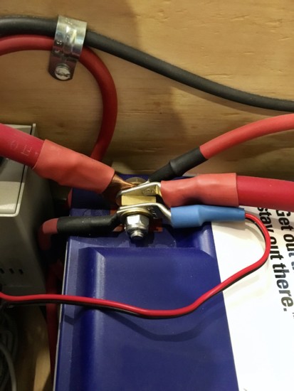 Electrical wiring connected to a battery terminal