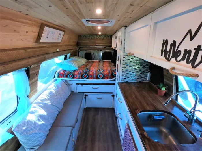 the interior of a DIY campervan, showing an example that you can build out your own dream home without going into debt