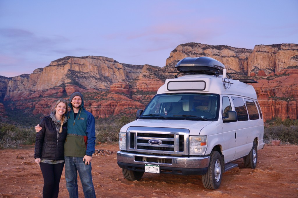 Jake and Emily posing in from of the van behind the red rocks in Sedona, AZ