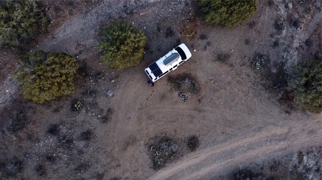A arial drone photo of a campervan at a campsite
