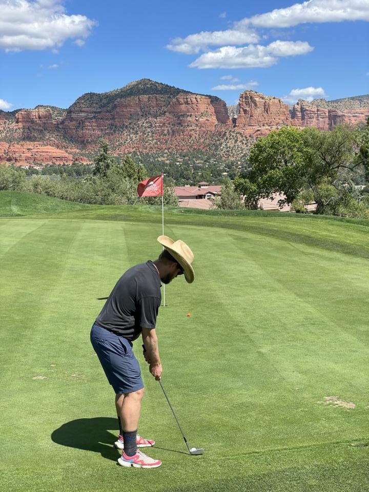 a guy putting at Sedona Golf Resort which is one of most fun things to do in Sedona