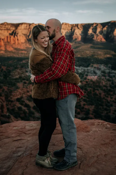 Jake and Emily embracing and laughing (Sedona)c