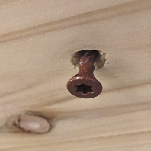 A screw head that shows a countersink hole to allow the screw to lay flush