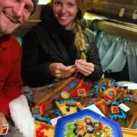 Jake and Emily playing travelers Catan in their camper van