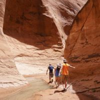 Hiking through a creek in Lake Powell with river hiking shoes