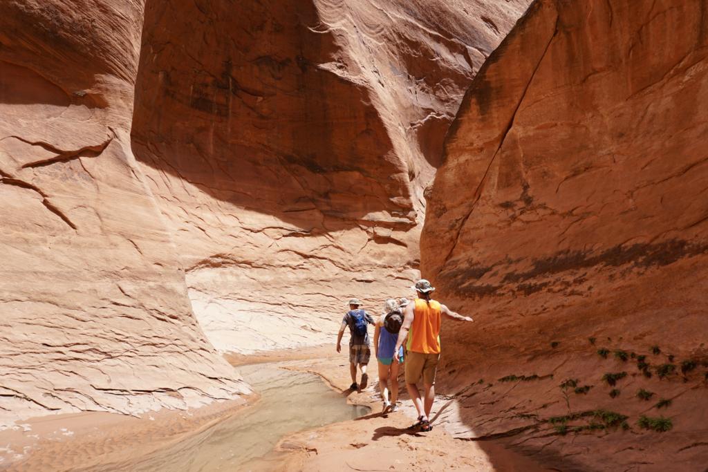 Hiking through a creek in Lake Powell with river hiking shoes