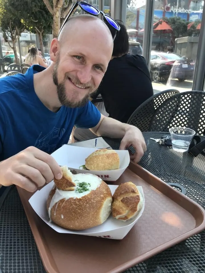 Jake eating a clam chowder bread bowl at Boudin's