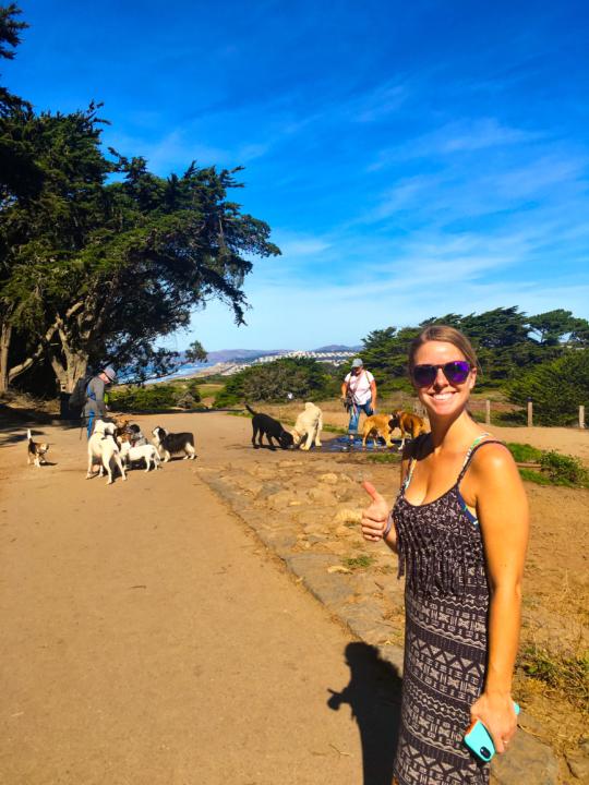 Emily at Fort Funston with dogs in the background