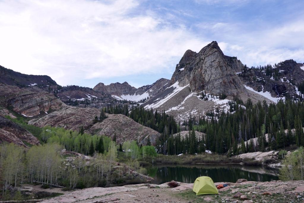 A yellow tent with Lake Blanche in the Background