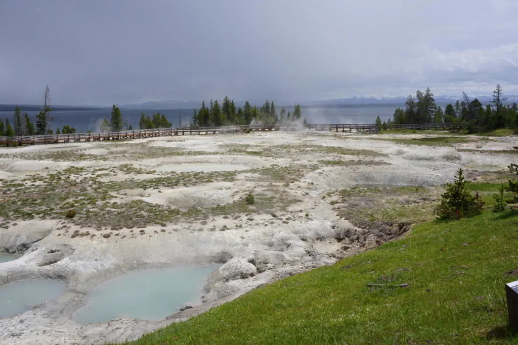 View of West Thumb Geyser with Yellowstone Lake In the background