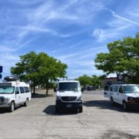 Three different types of white vans for stealth camping