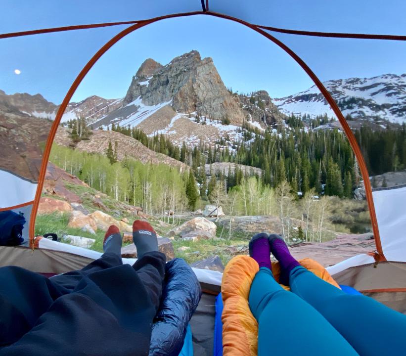 View of Sundial Peak at Lake Blanche Through the tent with Jake and Emilys feet