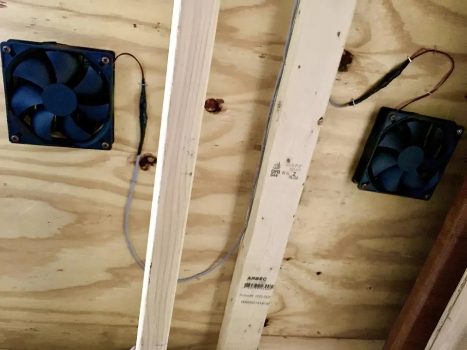Both fans fully installed and wired on the underside of the bed platform