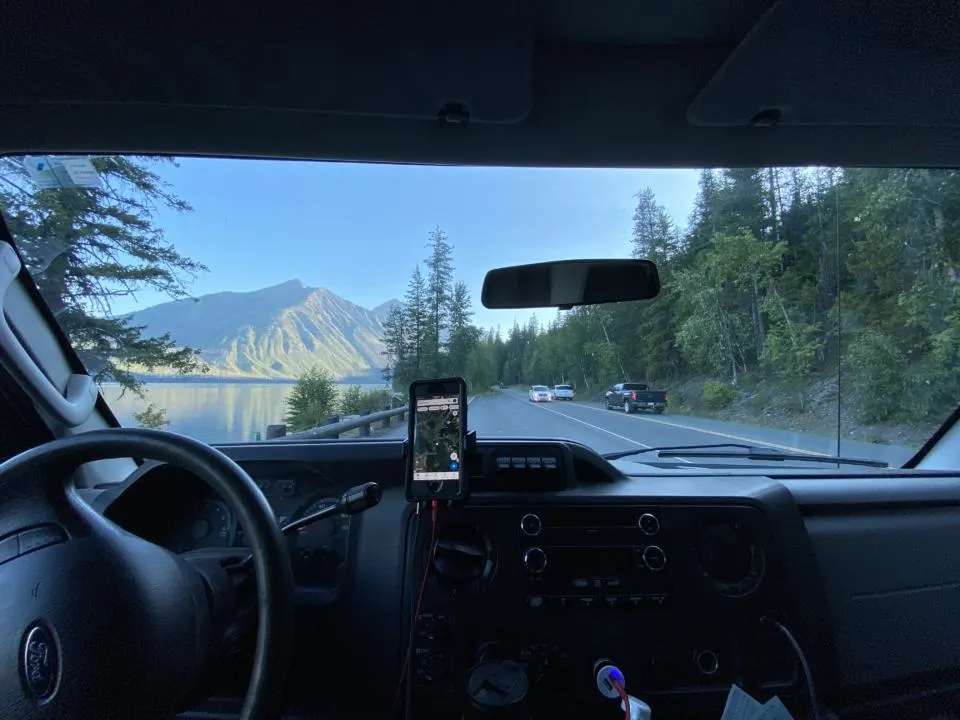 GPS on a phone mount on a Roadtrip out the front windshield at Glacier National Park