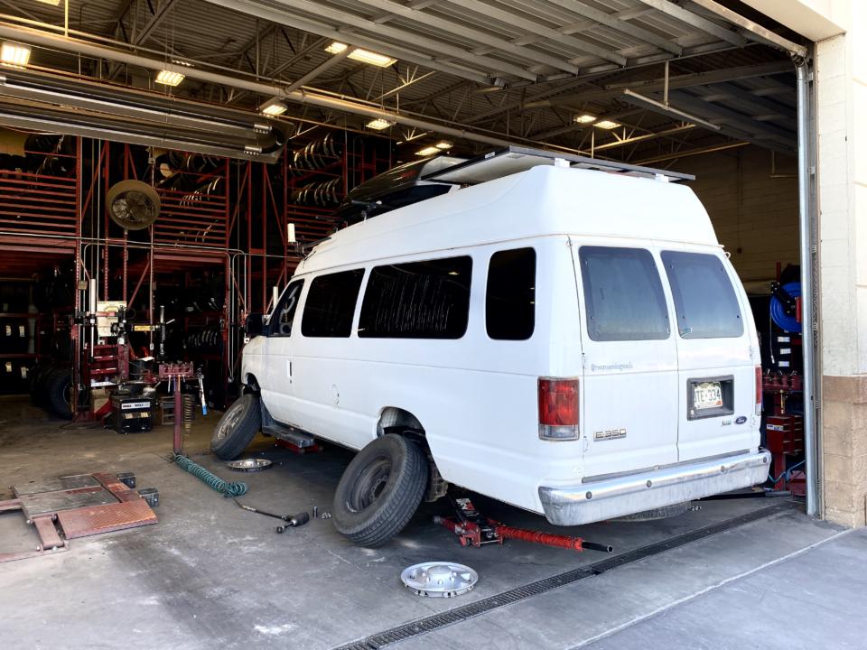 Our Ford E-350 Van getting it's tire rotated
