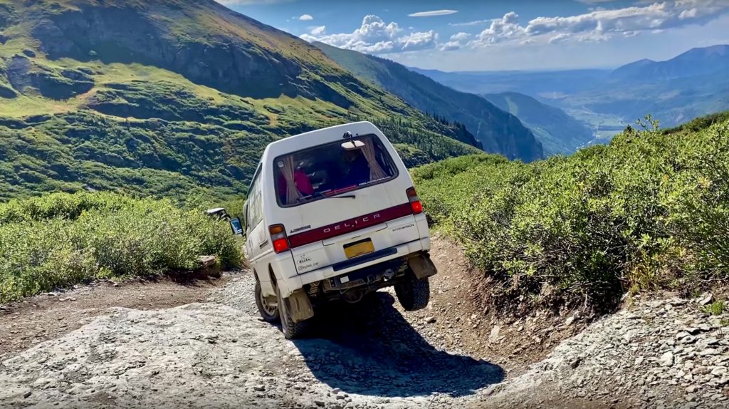 a van driving the Black Bear Pass which is one of the best things to do in Ouray, CO