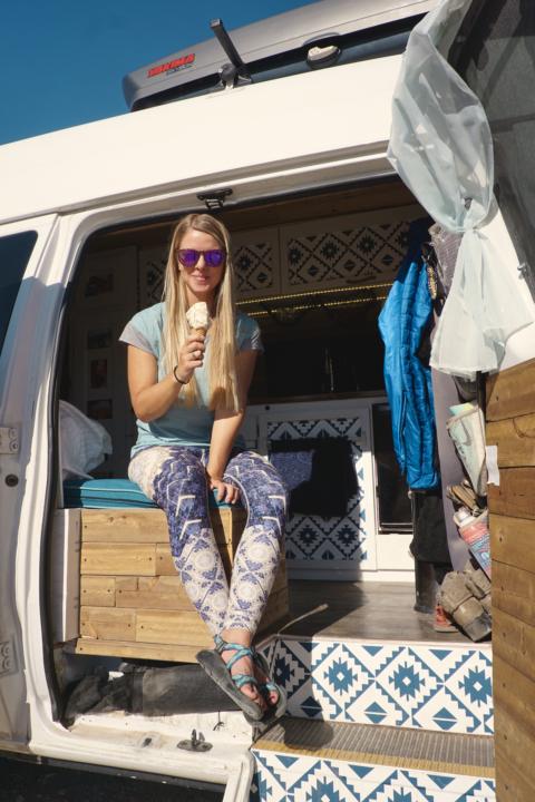 Eating an ice cream cone with one of the best fridges with a freezer for campervans.