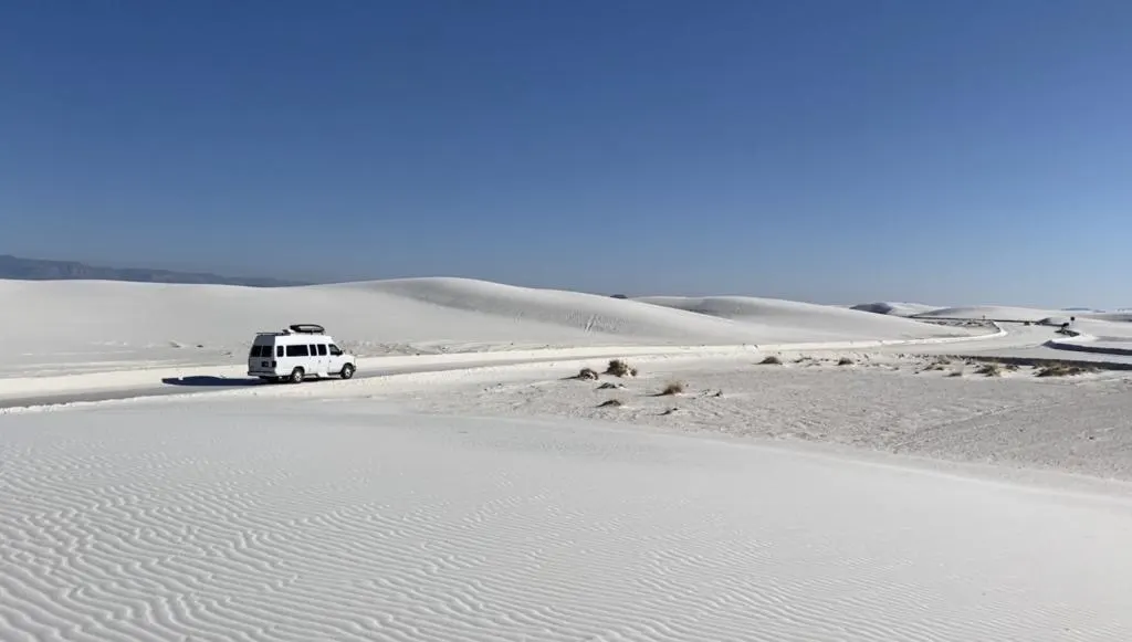 a campervan driving along the loop drive at White Sands National Park
