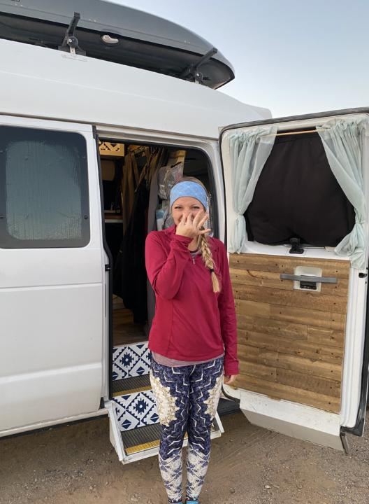Emily covering her nose because she needs to minimize funky smells in a camper van