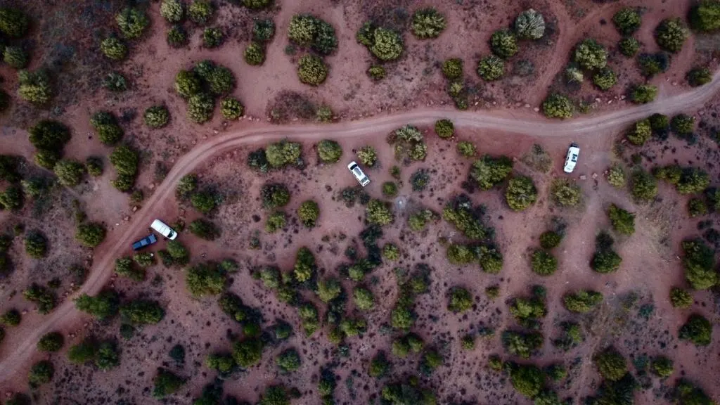 drone shot of vans camping on blm land