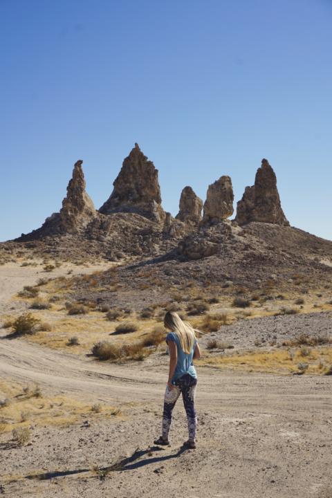 A woman walking around the Trona Pinnacles