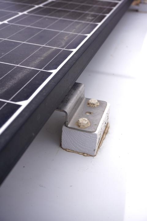 Mount solar panels on a fiberglass roof van