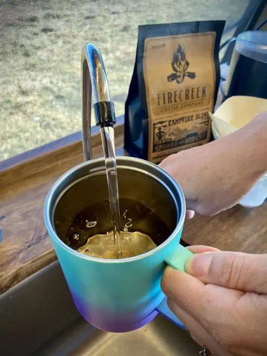 Measuring the water to make the best cup of coffee in vanlife