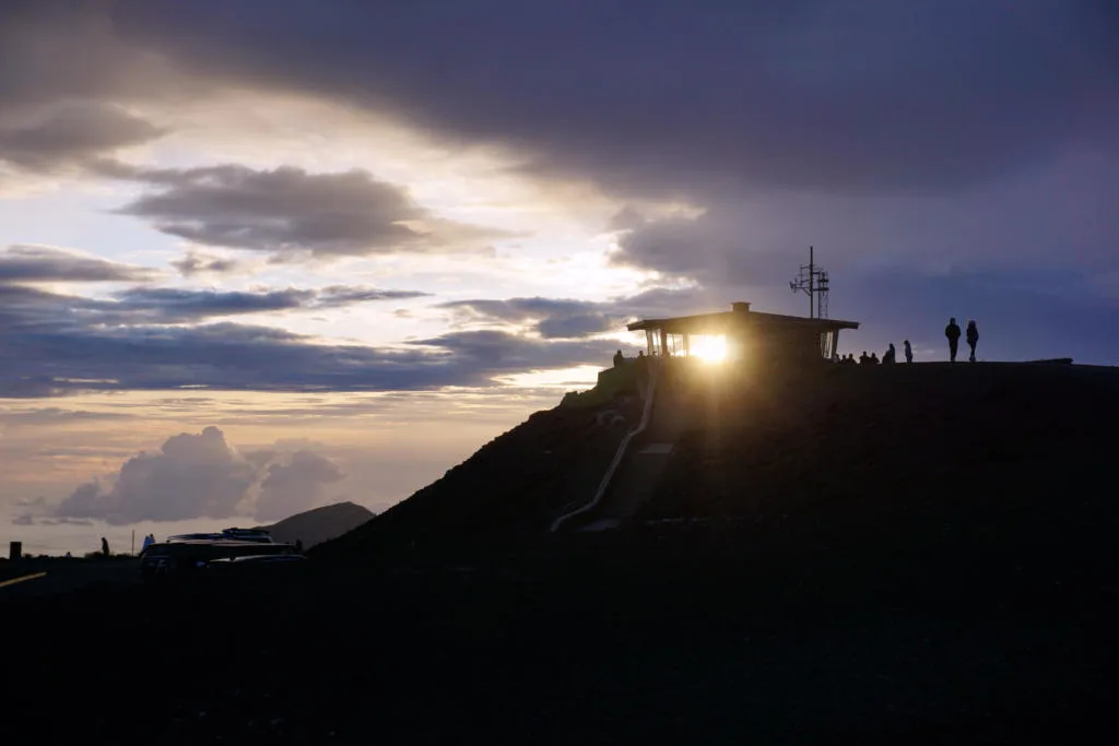Haleakala Sunrise with the sun peaking through the viewing house