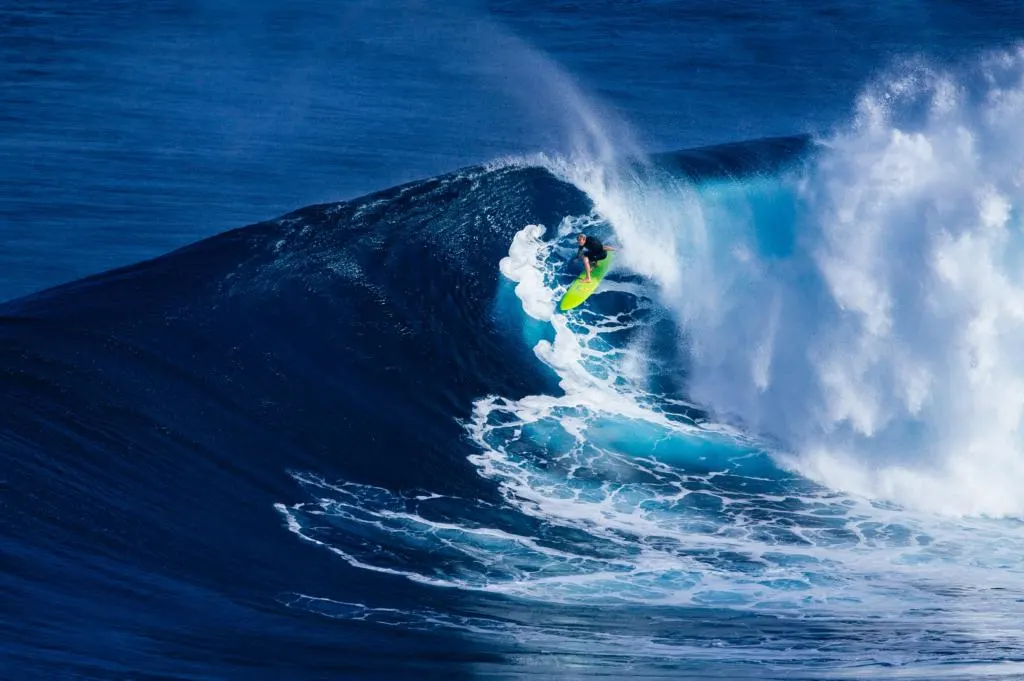watch legendary surfers for how to travel Maui on a budget
