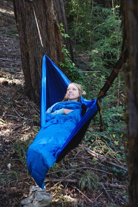 Emily Hammocking with The Best Down Puffy Blanket which is one of the best van life gifts