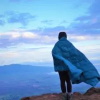 On The Top Of A Mountain with The Best Down Puffy Blanket - Get Out Gear Review