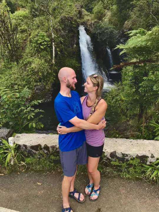 Jake and Emily, the Two Roaming Souls happy to be hanging by beautiful waterfalls in Maui.