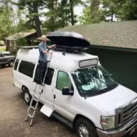 Mount ski carbo box on fiberglass hightop camper van.