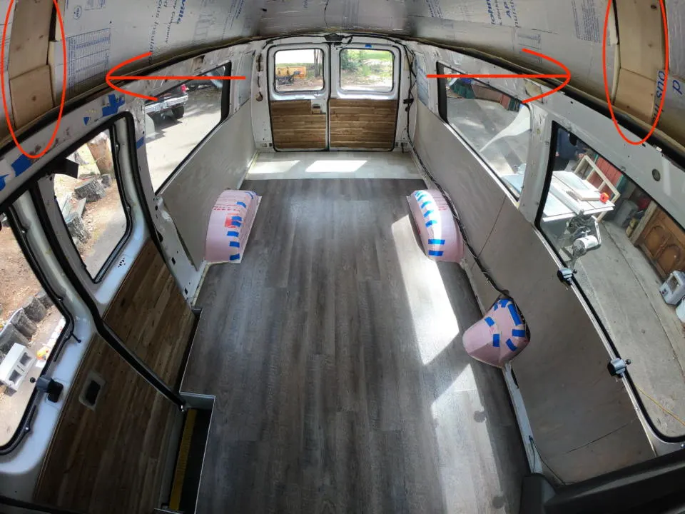 The inside of our fiberglass roof van with wooden supports.