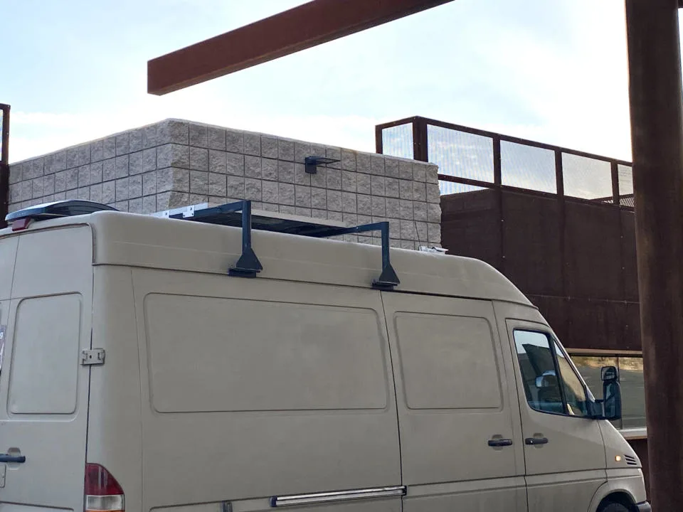 Extra Tall gutter mounted foot roof rack for mounting on campervan.