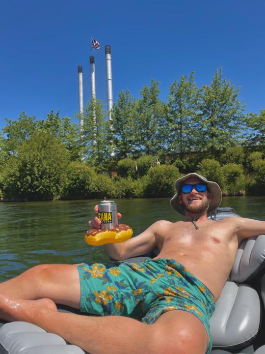Jake with the 3 stacks behind him while Floating The Deschutes River in Bend, OR