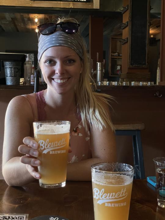 Emily holding a beer from Blewett Brewing Company in Leavenworth Washington