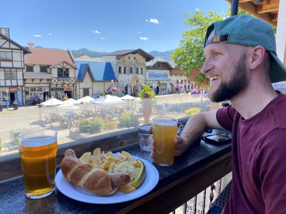 Jake enjoying a beer and a bratwurst at Rhein Haus in Leavenworth Washington