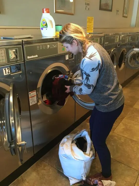 Emily Doing Laundry On The Road At A Laundromat