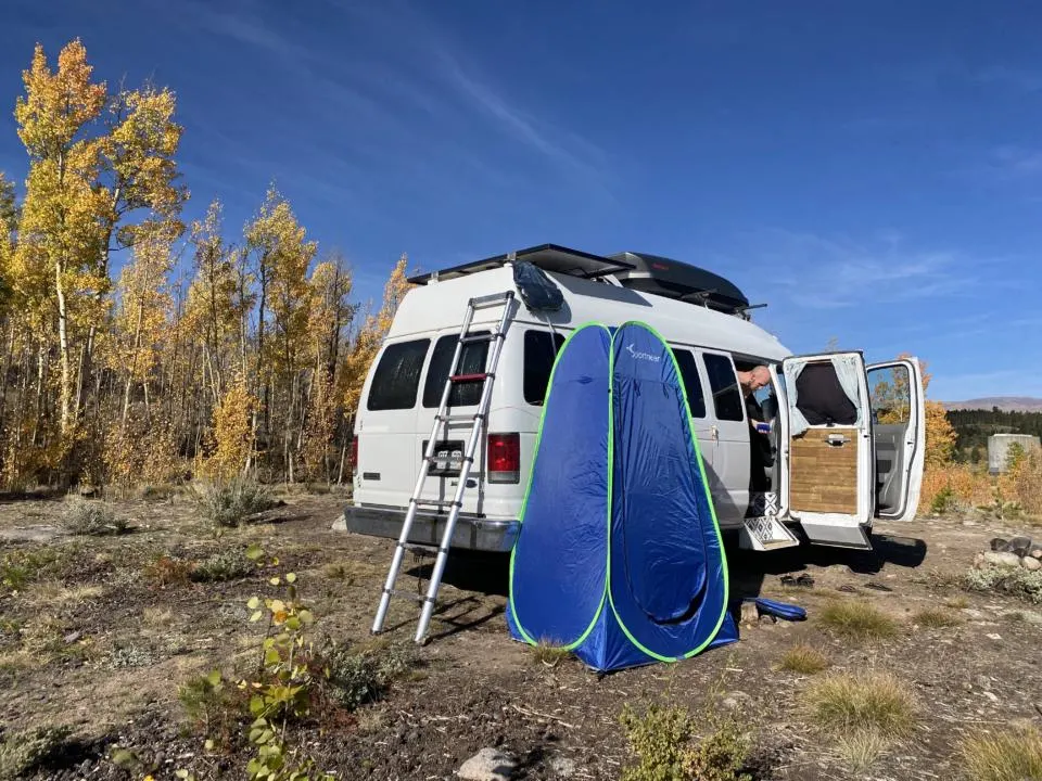 a pop-up shower is one of our favorite camper van hacks to keep you warm during a shower