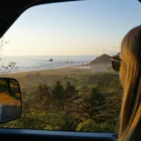 Emily starring out the window on an Oregon Coast Road Trip