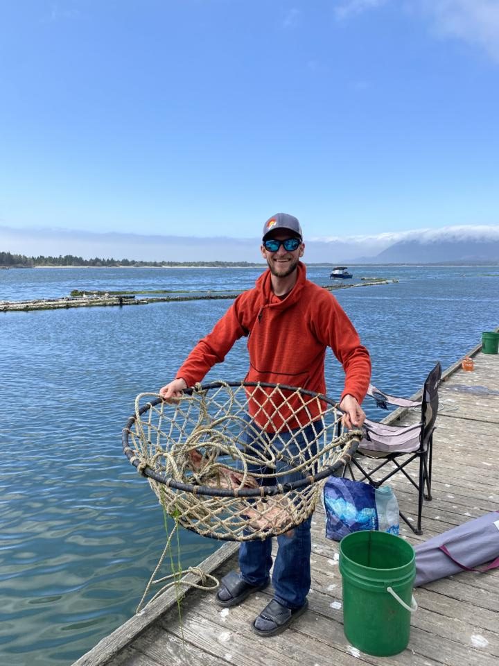 Jake throwing in a crabbing net at Kelly's Brighton Marina