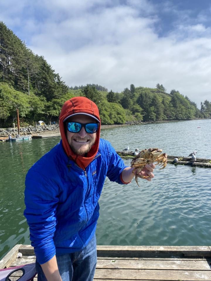 Jake with one of the crabs he caught at Kelly's Brighton Marina On our Oregon Coast Road Trip