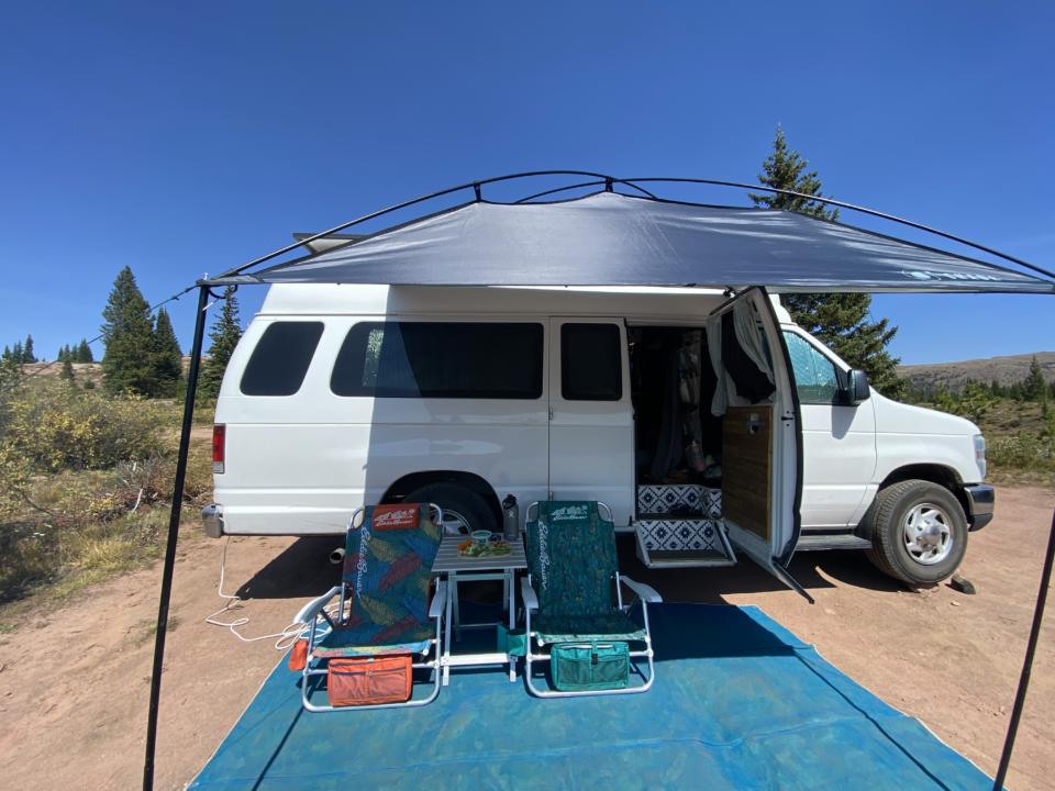Our camper van outdoor living space, showing one of the best awnings for camper vans with our Moonshade