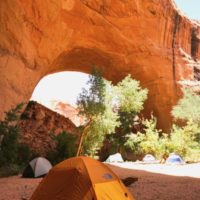 a tent in front of Jacob Hamlin's Arch
